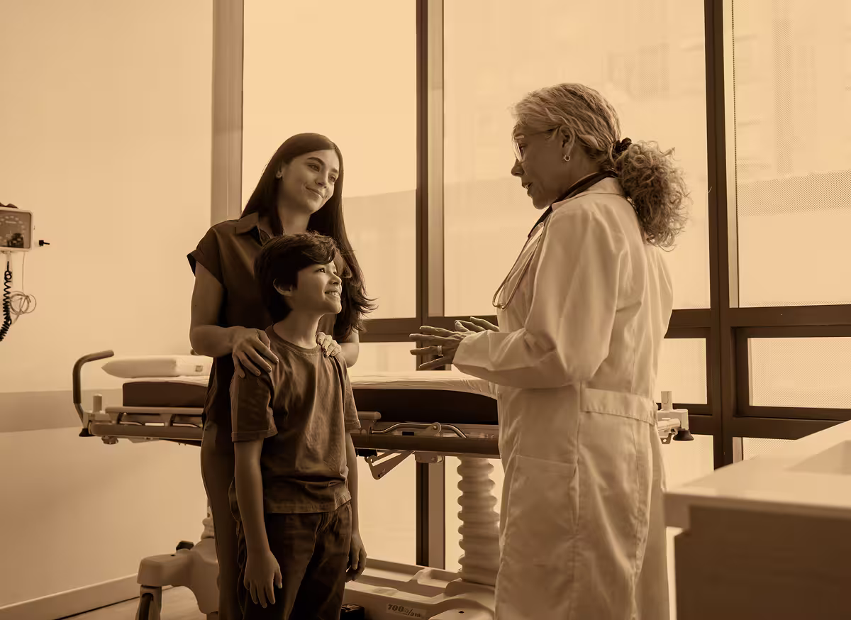 Doctor speaking with a parent and child during a medical visit